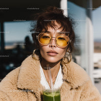 Stylish Young Woman Wearing Yellow Tinted Sunglasses Outdoors
