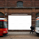 Urban street scene with blank billboard and passing trams