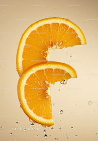 Fresh orange slices with water droplets close up