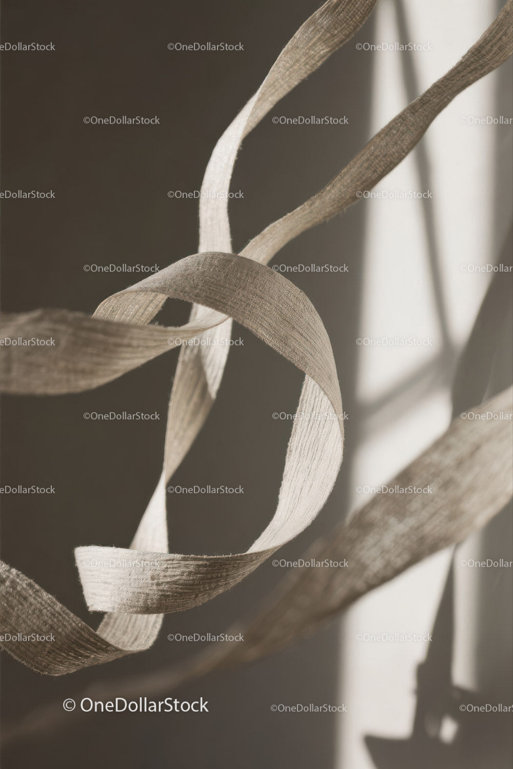 Close-up of White Plastic Ribbon Waste on Sandy Beach
