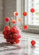 Fresh Red Grapes Splashing with Water Droplets