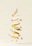 Floating Sliced Pear with Delicate Pink Flower Petals