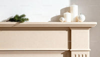 Minimalist Christmas decor on beige mantelpiece