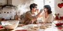 Couple Playfully Baking Heart-Shaped Cookies Together