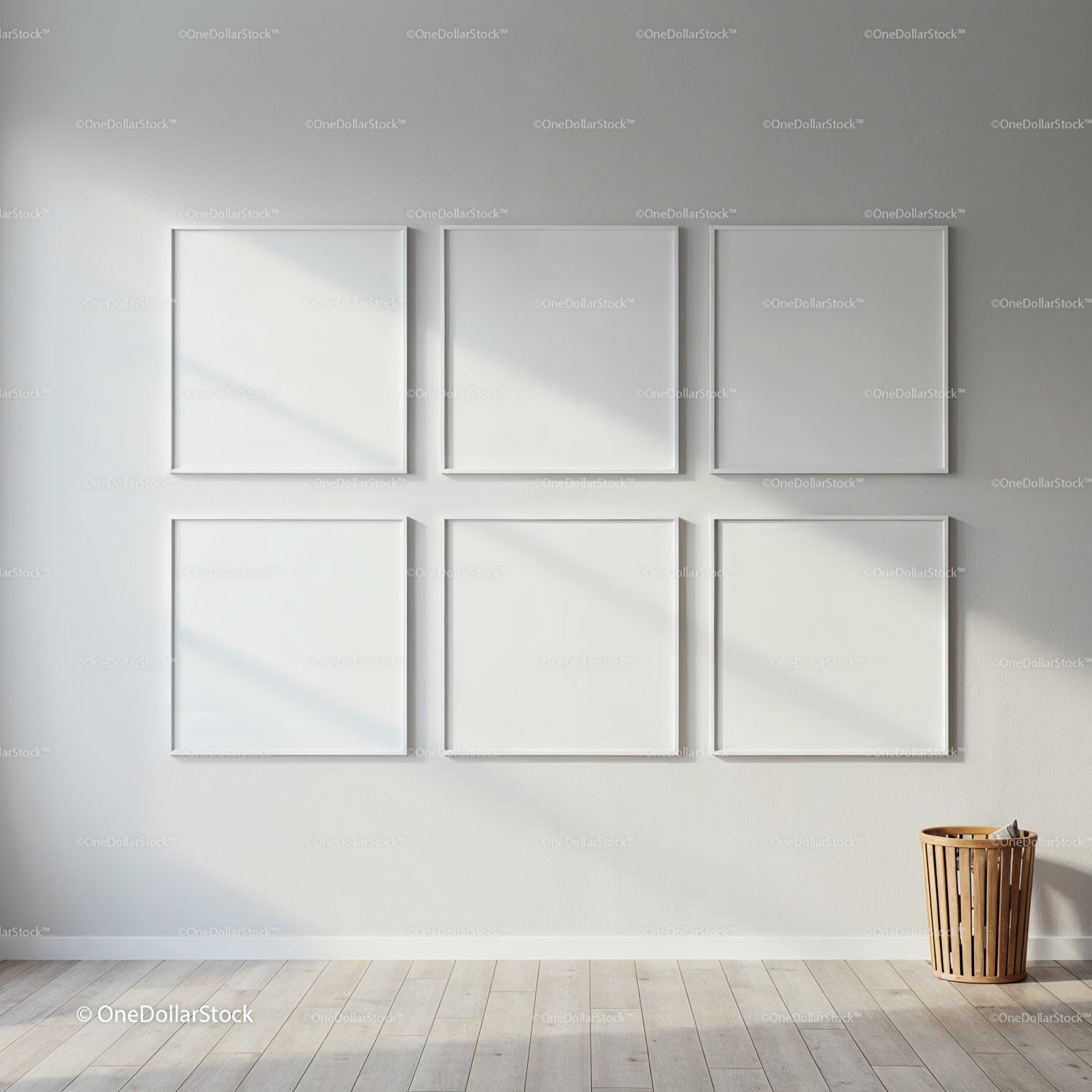 Minimalistyczna ściana galerii z sześcioma pustymi, białymi ramkami