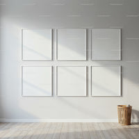 Minimalist gallery wall with six blank white frames