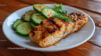 Juicy Grilled Chicken Fillet with Fresh Cucumber Slices on White Plate