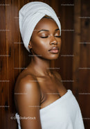 Serene Black Woman with Skin Care Towel Wrap and Relaxed Expression