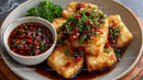 Crispy Fried Fish with Spicy Chili Sauce and Fresh Herbs