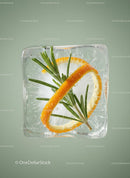 Fresh rosemary and orange slice frozen in ice cube
