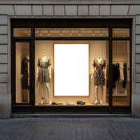 Fashionable summer dresses displayed in boutique window