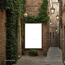 Cozy narrow street with illuminated lanterns and greenery