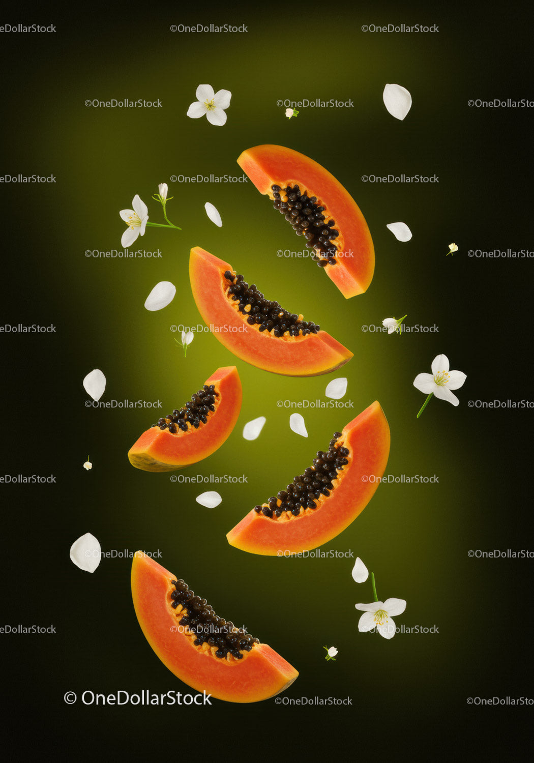 Fresh papaya slices with delicate white flowers on green