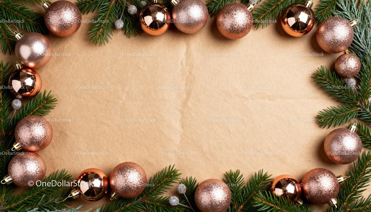 Christmas frame with rose gold baubles and pine branches