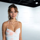 Young Woman Smiling in Summer Dress with Jewelry In Studio