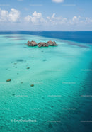 Tropical Overwater Bungalows Over Calm Turquoise Ocean