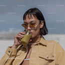 Stylish Woman Drinking Smoothie in Outdoor Summer Setting