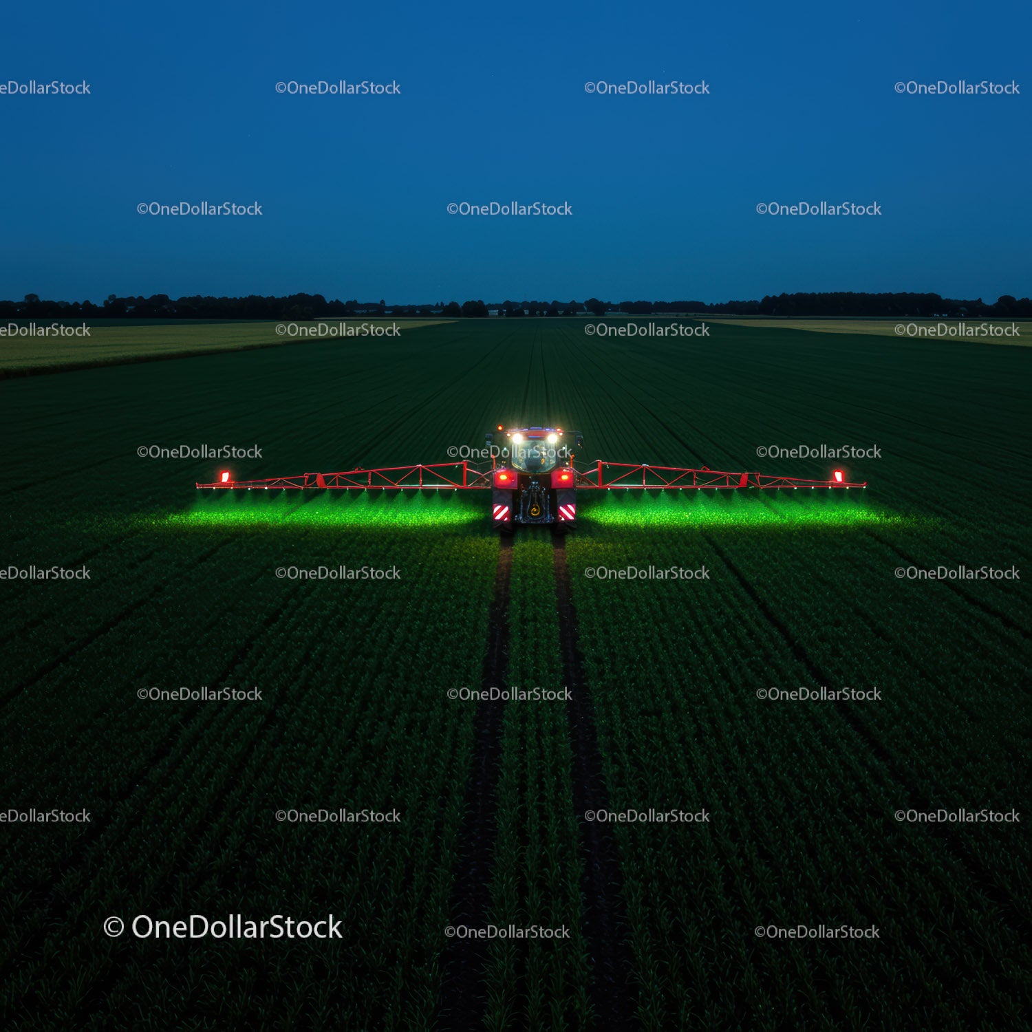 Farm vehicle operating in green fields at night