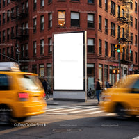 Busy City Corner with Yellow Taxis and Blank Billboard