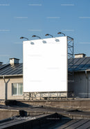 Empty billboard on rooftop against clear blue sky