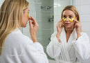 Young Woman Applying Under Eye Patches for Skincare Routine
