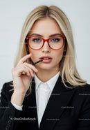 Elegant Young Woman in Red Glasses Wearing Black Blazer and White Shirt