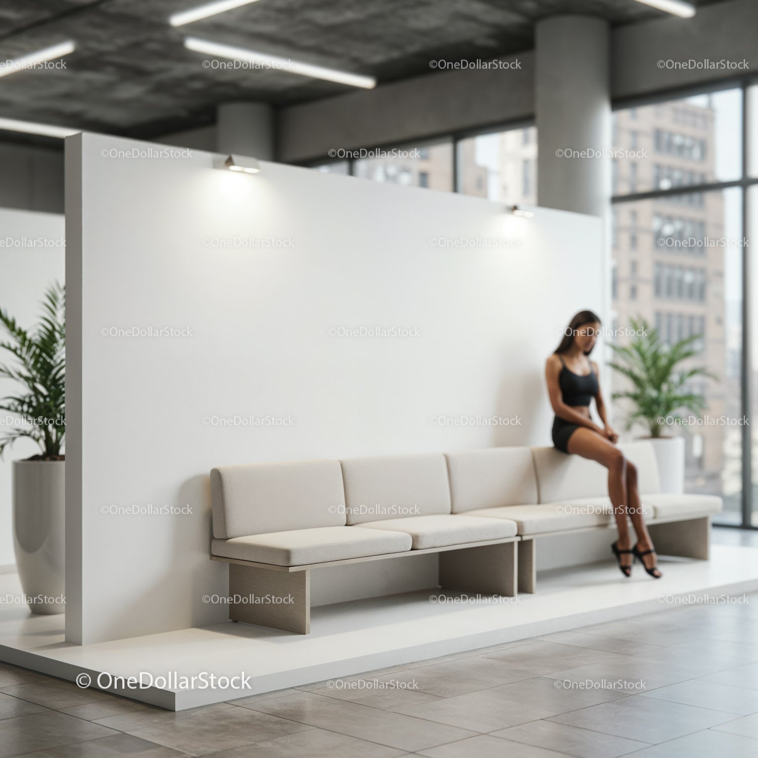Pensive woman sitting on modern bench in bright lobby