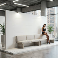 Pensive woman sitting on modern bench in bright lobby