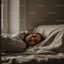 Relaxed Woman Sleeping in Cozy Bedroom with Soft Bedding