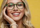 Smiling woman with green glasses and pearl bracelet