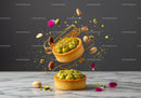 Elegant pistachio tarts with flying nuts and petals
