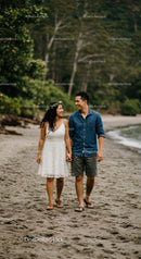Romantic Young Couple Walking Hand in Hand on Beach at Sunset