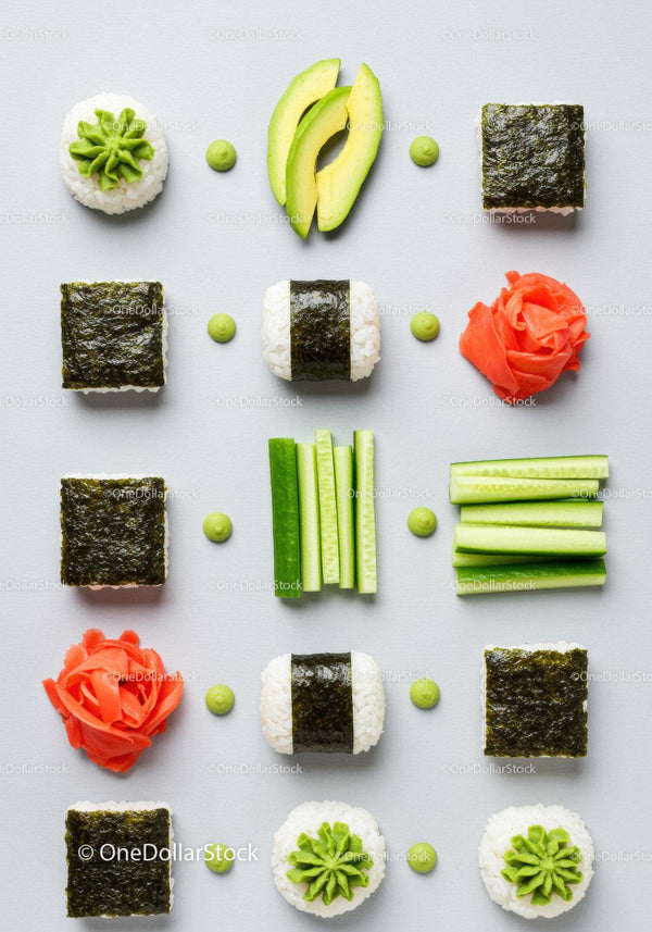 Artistic arrangement of sushi ingredients and garnishes