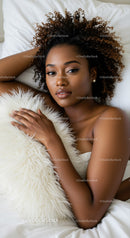 Relaxed woman lying on bed with soft white pillow
