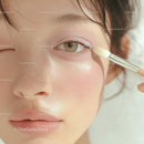 Close-up of Woman Applying Eyeshadow with Makeup Brush