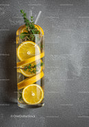 Refreshing lemon and rosemary infused water in glass