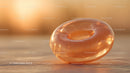 Luxurious Golden Glass Gemstone with Sparkling Glitter in Sunlight