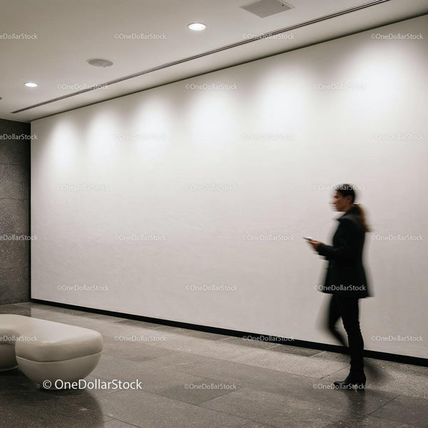 Blurred woman walking in modern minimalistic lobby JPG Mockup Image