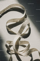 Elegant Fabric Ribbon Curled on Light Surface
