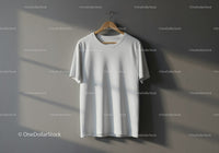 Plain white t-shirt hanging on wooden hanger indoors