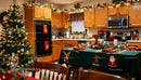 Cozy kitchen decorated for Christmas with festive table setting