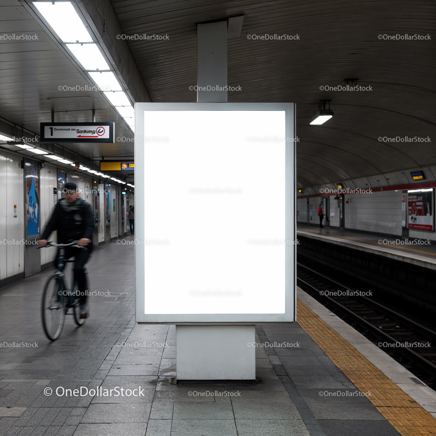 Urban subway station with blank lightbox and cyclist