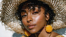 Elegant Woman Wearing Wide Brim Straw Hat with Summertime Style