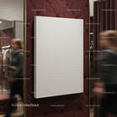 Blank canvas on burgundy wall in fashion boutique