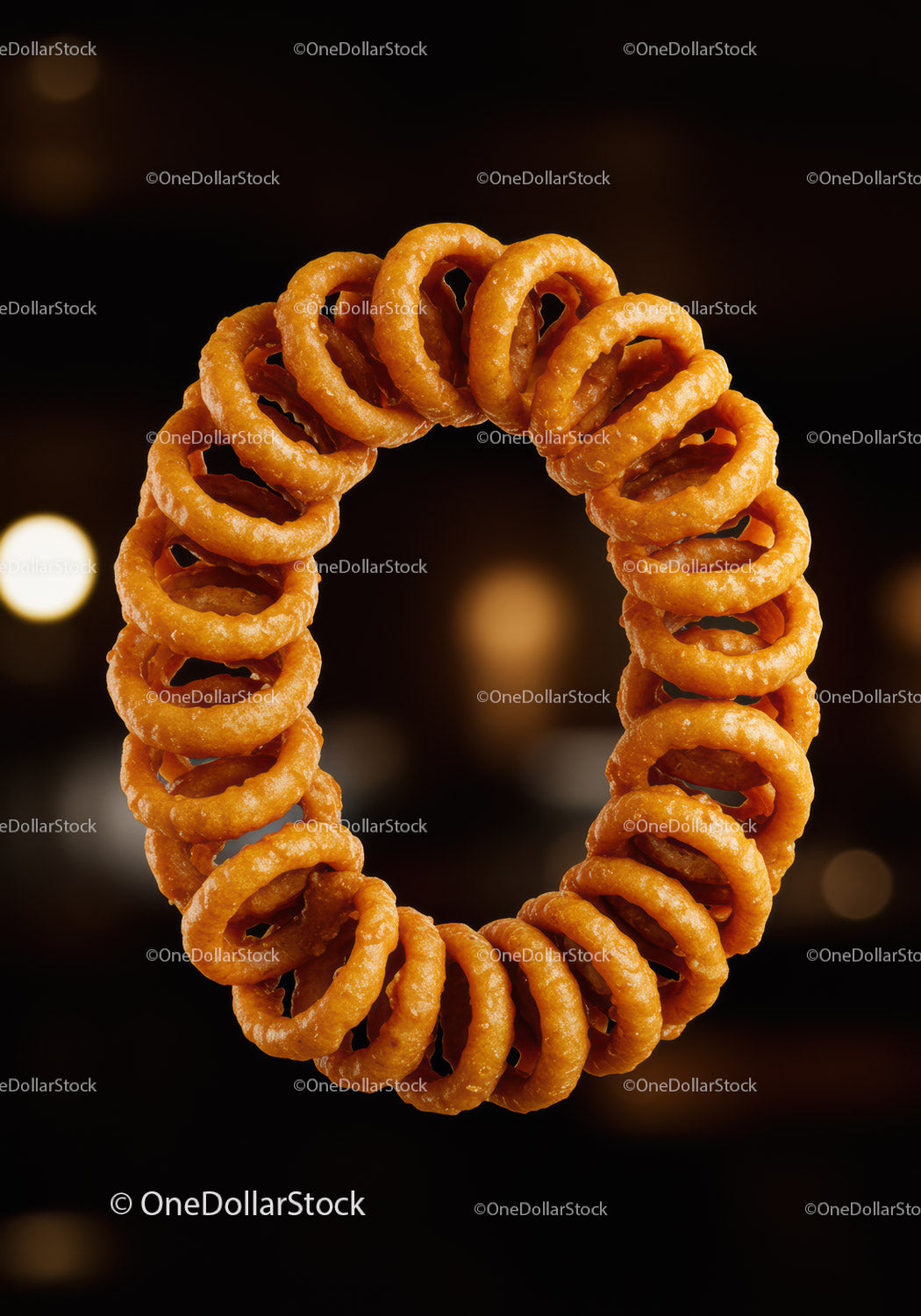 Circle of Crispy Fried Onion Rings on Dark Background