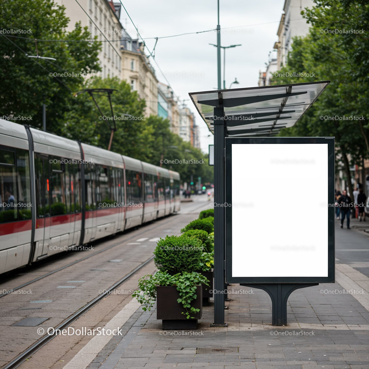 Modern tram station with green plants in urban setting