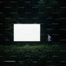 Runner Passing a Large Illuminated Billboard in Forest