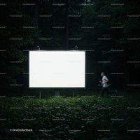 Runner Passing a Large Illuminated Billboard in Forest