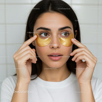 Young Woman Applying Gold Under-Eye Masks for Skin Rejuvenation