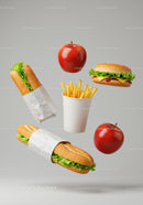 Floating fast food combo with fresh apples and fries